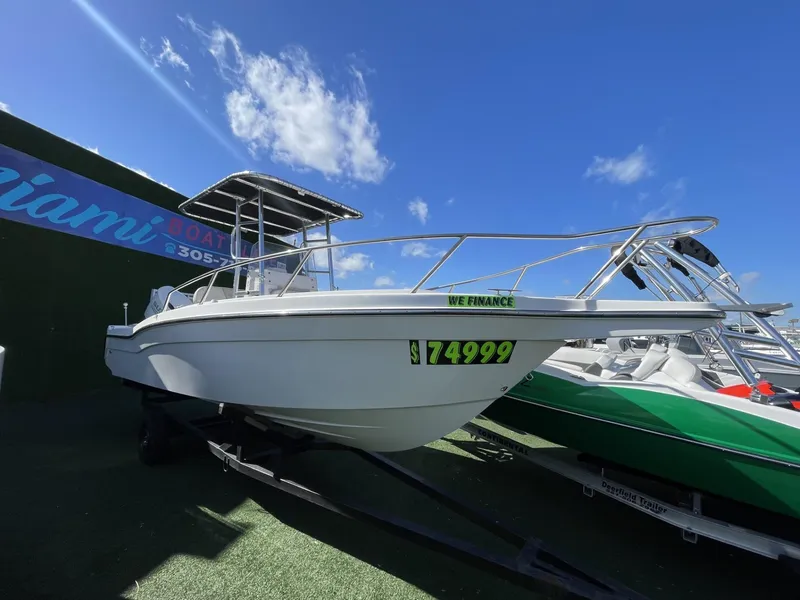 Slide: The Image of 2022 Wellcraft 220CC boat for sale at $74,999 with financing options. - 11