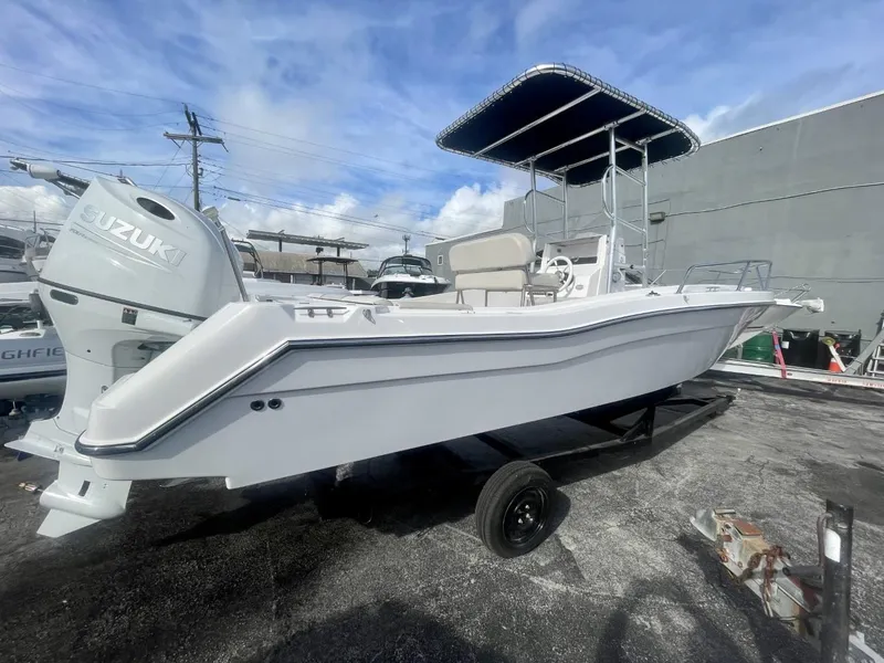 Slide: The Image of 2022 Wellcraft 220CC boat with Suzuki outboard motor on trailer. - 16