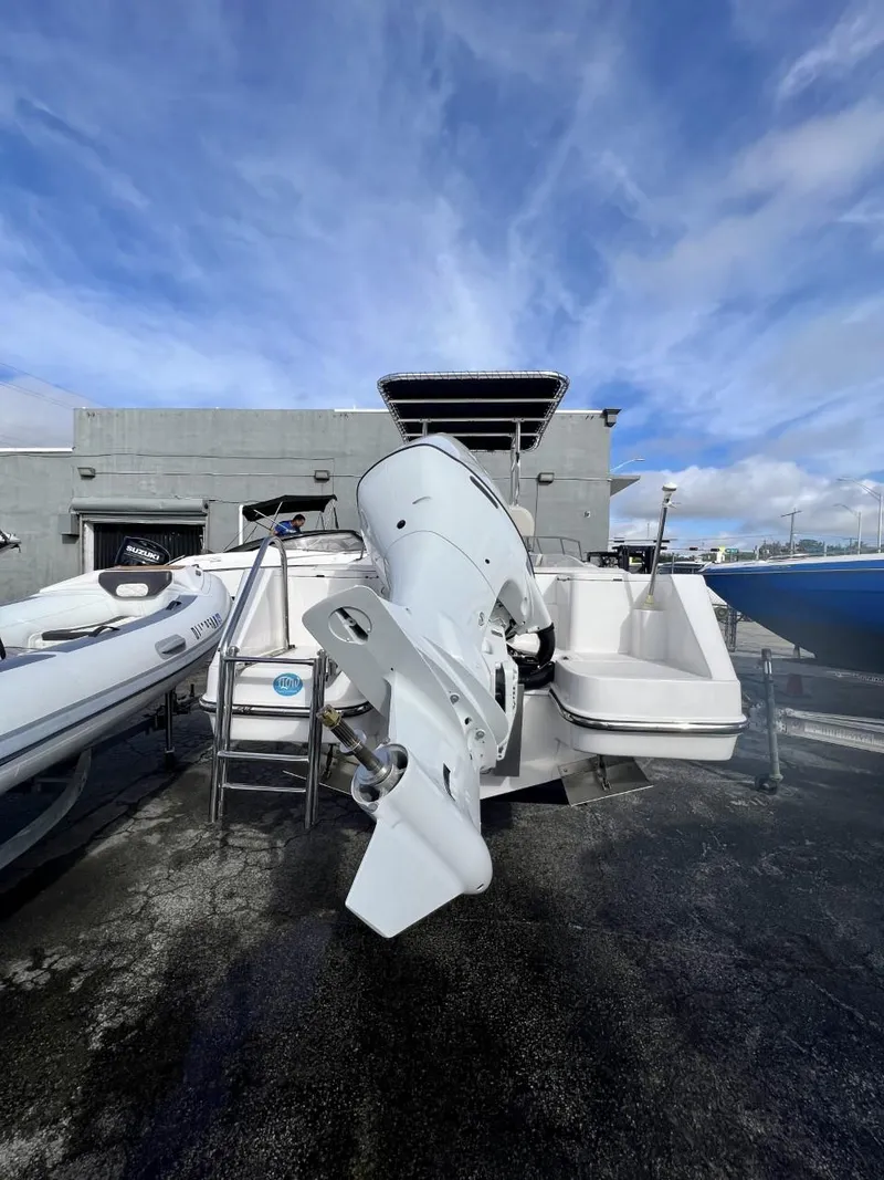 Slide: The Image of 2022 Wellcraft 220CC boat with outboard motor on display. - 21