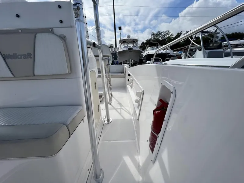Slide: The Image of 2022 Wellcraft 220CC boat interior with seating and safety equipment. - 29