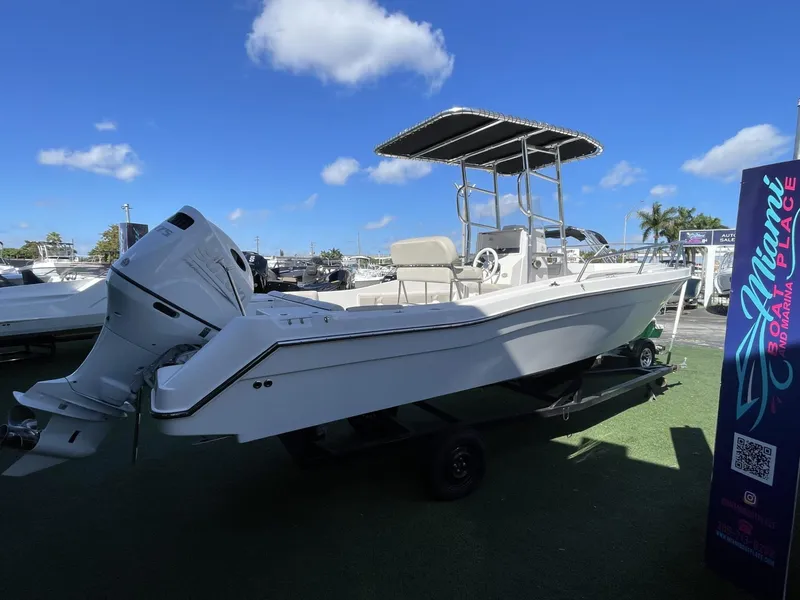 Slide: The Image of 2022 Wellcraft 220CC boat on display under a clear blue sky. - 3