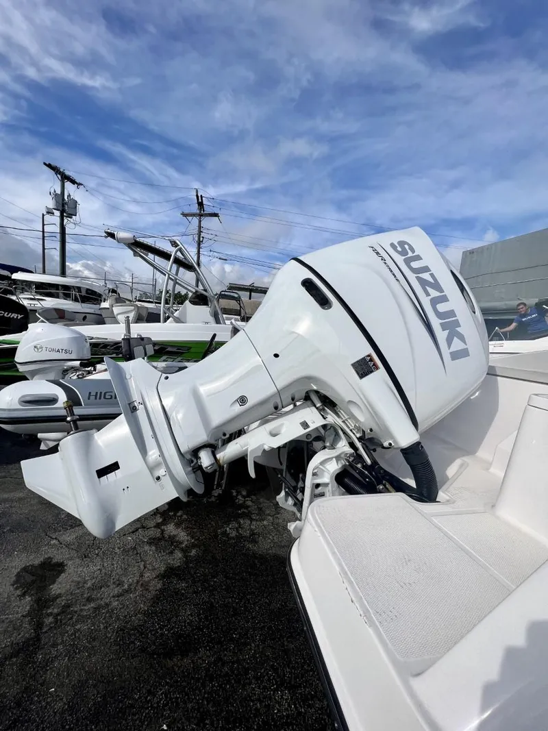 Slide: The Image of 2022 Wellcraft 220CC boat with Suzuki outboard motor. - 31