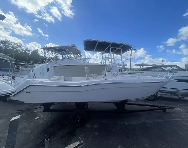 Slide: The Image of 2022 Wellcraft 220CC boat on trailer under blue sky. - 32
