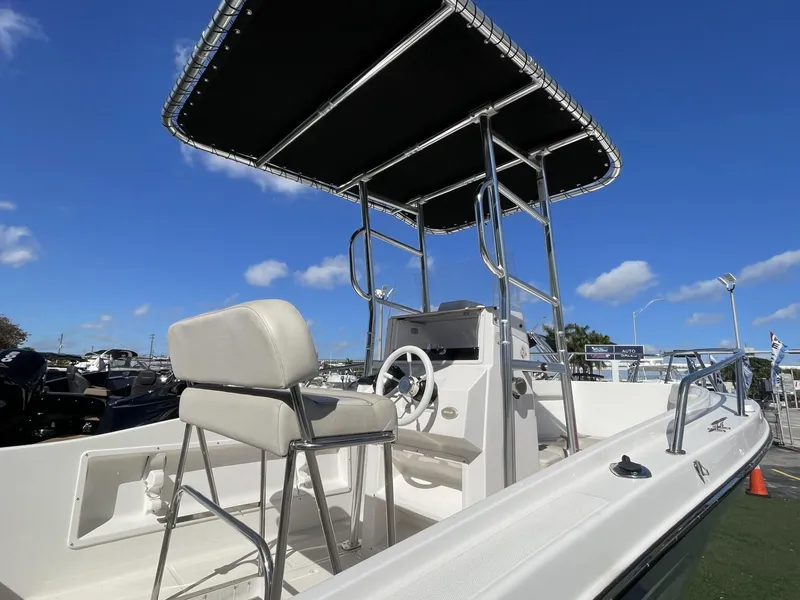 Slide: The Image of 2022 Wellcraft 220CC center console boat with T-top and helm station. - 4