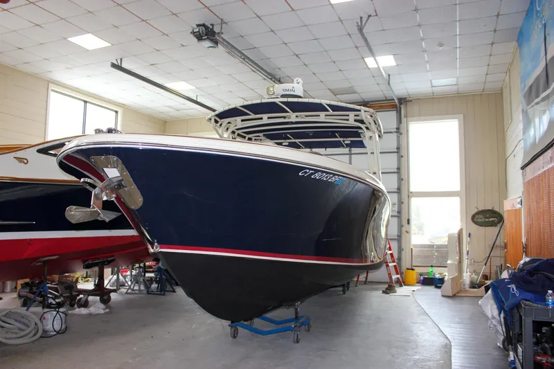 Slide: The Image of 2014 Chris-Craft Catalina 29 Sun Tender in indoor storage facility. - 2