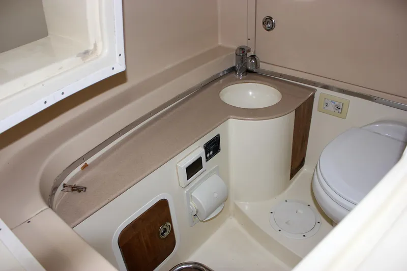 Slide: The Image of 2014 Chris-Craft Catalina 29 Sun Tender bathroom with sink and toilet. - 31
