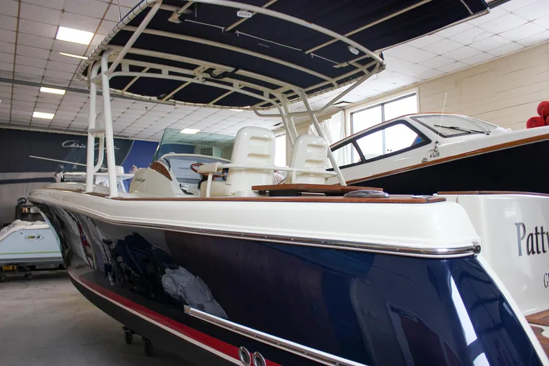 Slide: The Image of 2014 Chris-Craft Catalina 29 Sun Tender boat in showroom, featuring sleek design and modern amenities. - 36