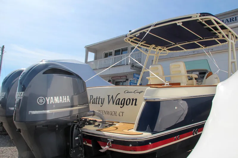 Slide: The Image of 2014 Chris-Craft Catalina 29 Sun Tender with Yamaha engines, docked outdoors. - 42