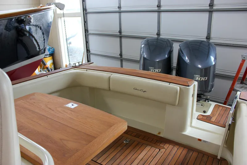 Slide: The Image of 2014 Chris-Craft Catalina 29 Sun Tender with twin 300 engines in a garage setting. - 8