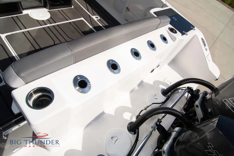 Slide: The Image of Fountain 32 NX 2022 boat with fishing rod holders and engines. - 11