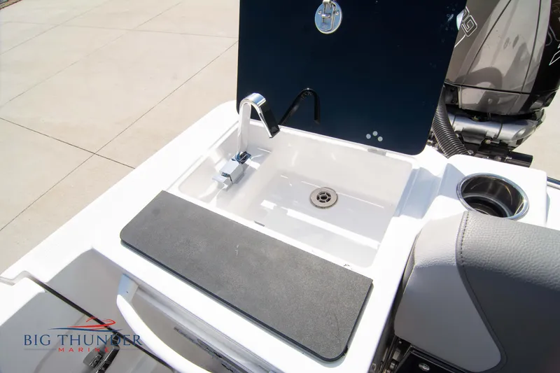 Slide: The Image of Fountain 32 NX 2022 boat with sink and faucet. - 16