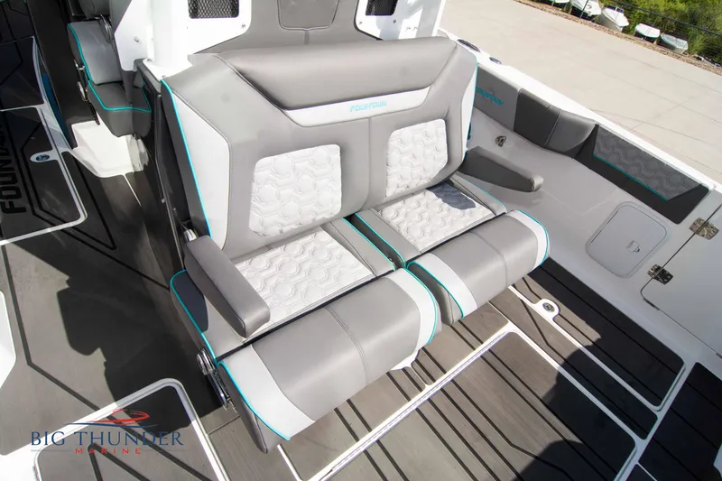 Slide: The Image of Interior of 2022 Fountain 32 NX with gray and white seating. - 19