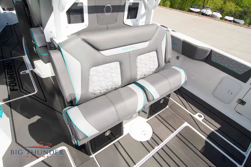 Slide: The Image of Interior of a 2022 Fountain 32 NX boat with gray seating. - 20