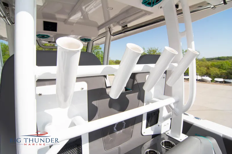 Slide: The Image of Interior view of Fountain 32 NX boat, featuring fishing rod holders. - 21