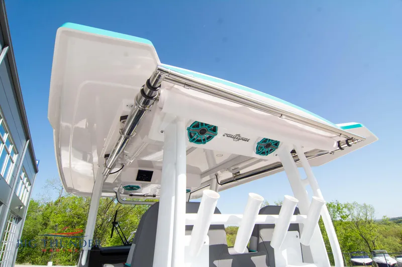 Slide: The Image of Fountain 32 NX 2022 boat with speakers and fishing rod holders. - 22