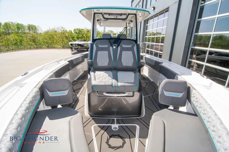 Slide: The Image of Interior view of a 2022 Fountain 32 NX boat with modern seating. - 47