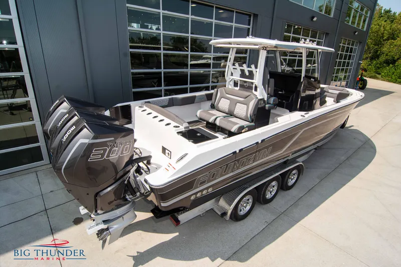 Slide: The Image of 2022 Fountain 32 NX boat with powerful engines on trailer. - 5