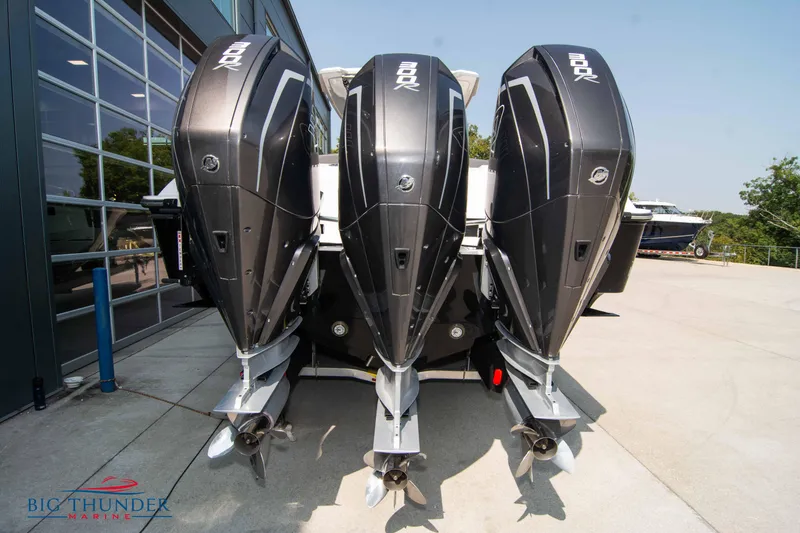 Slide: The Image of Three outboard motors on a 2022 Fountain 32 NX boat. - 6
