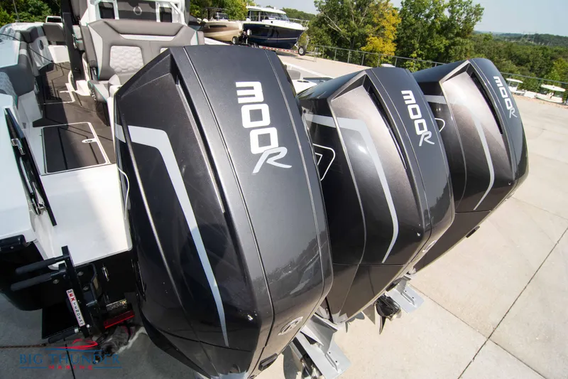 Slide: The Image of Three Mercury 300R outboard engines on a Fountain 32 NX boat. - 7
