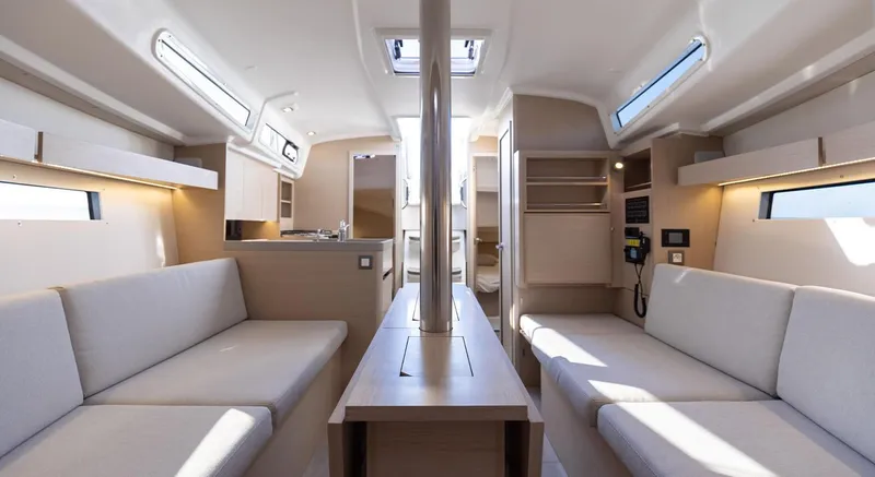 Slide: The Image of Modern interior of 2024 Beneteau Oceanis 34.1 sailboat with light wood finish. - 6