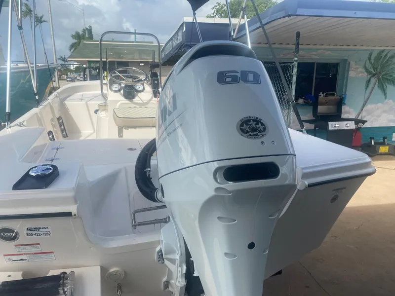 Slide: The Image of 2023 Carolina Skiff 162 JLS boat with 60 HP outboard motor. - 2