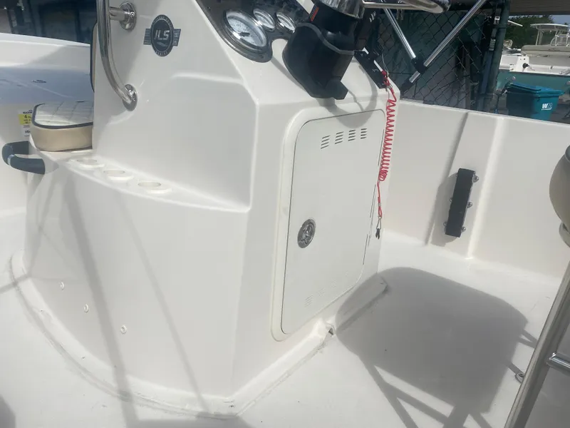 Slide: The Image of 2023 Carolina Skiff 162 JLS boat console with steering wheel and gauges. - 9