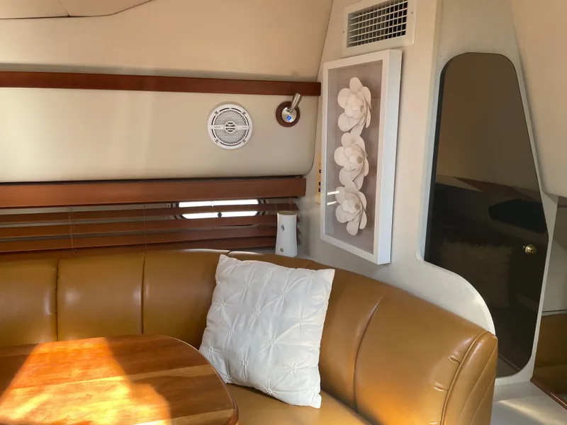 Slide: The Image of 1998 Cruisers Yachts 3375 Esprit interior with leather seating and wooden accents. - 16