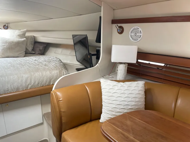 Slide: The Image of Luxurious 1998 Cruisers Yachts 3375 Esprit interior with cozy seating and elegant decor. - 17
