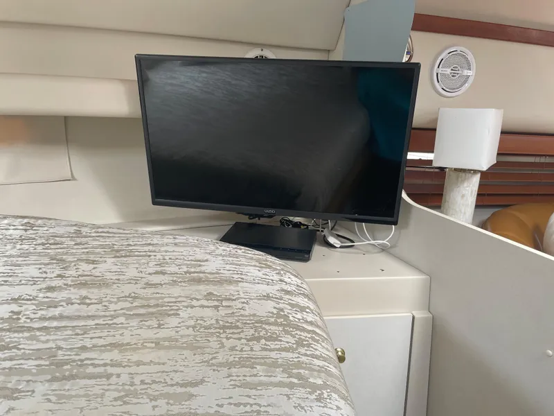Slide: The Image of 1998 Cruisers Yachts 3375 Esprit interior with TV and lamp. - 18