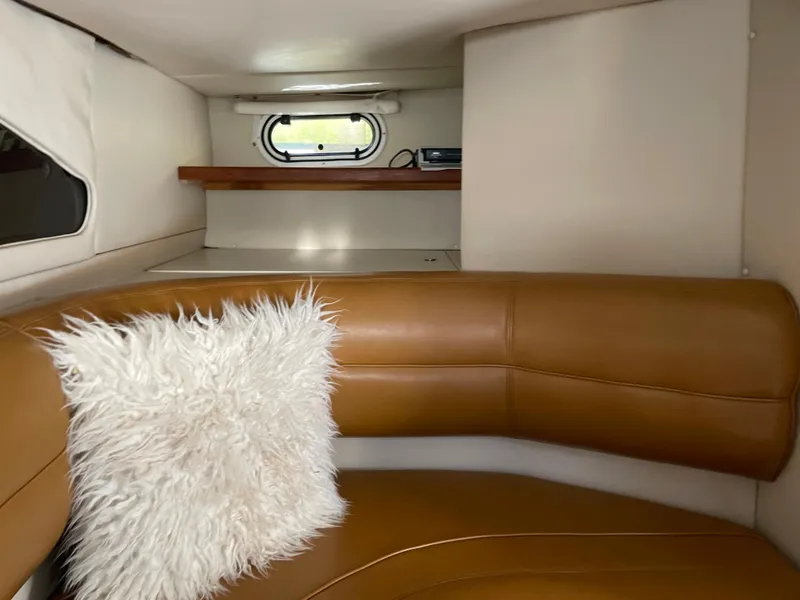 Slide: The Image of Interior of 1998 Cruisers Yachts 3375 Esprit with leather seating and fluffy pillow. - 20