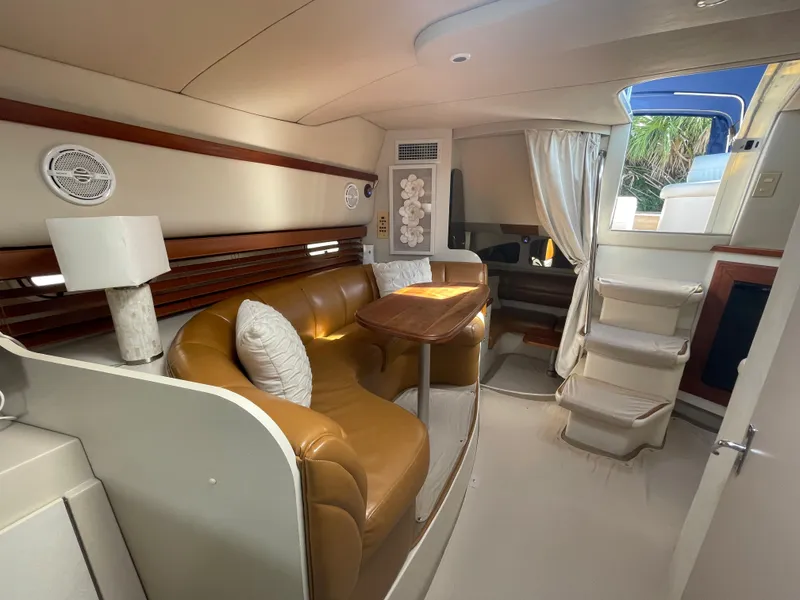 Slide: The Image of 1998 Cruisers Yachts 3375 Esprit interior with leather seating and wooden accents. - 25