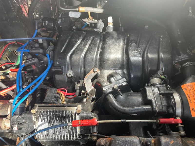 Slide: The Image of Engine compartment of a 1998 Cruisers Yachts 3375 Esprit with visible wiring and components. - 32