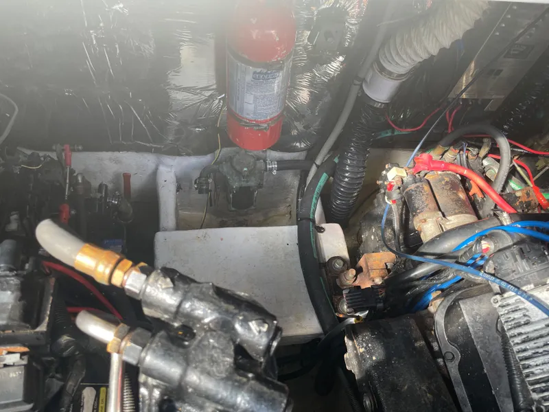 Slide: The Image of Engine compartment of 1998 Cruisers Yachts 3375 Esprit with visible wiring and components. - 33