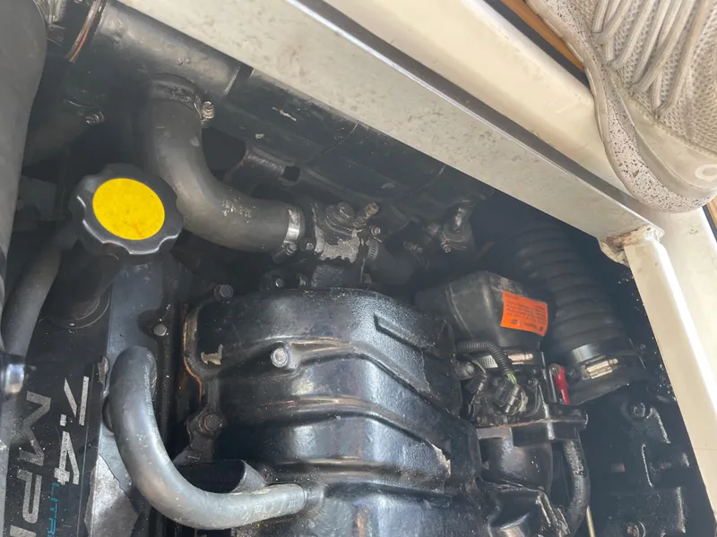 Slide: The Image of Engine compartment of 1998 Cruisers Yachts 3375 Esprit, showing mechanical components. - 36