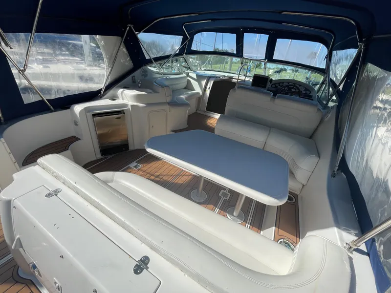 Slide: The Image of Interior of 1998 Cruisers Yachts 3375 Esprit with seating and table. - 11