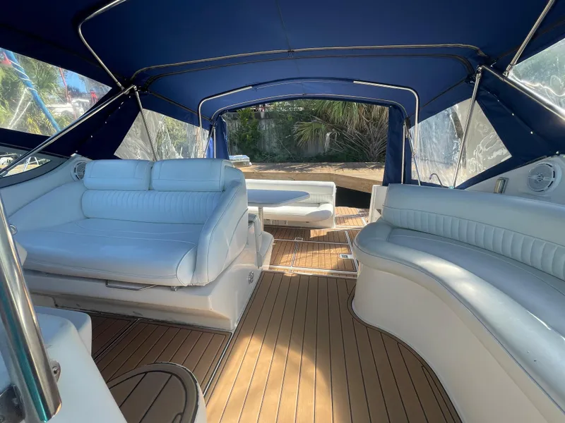 Slide: The Image of Luxurious 1998 Cruisers Yachts 3375 Esprit interior with blue canopy and white seating. - 14