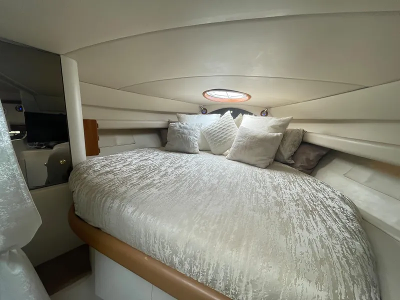 Slide: The Image of Luxurious cabin interior of 1998 Cruisers Yachts 3375 Esprit with plush bedding. - 24