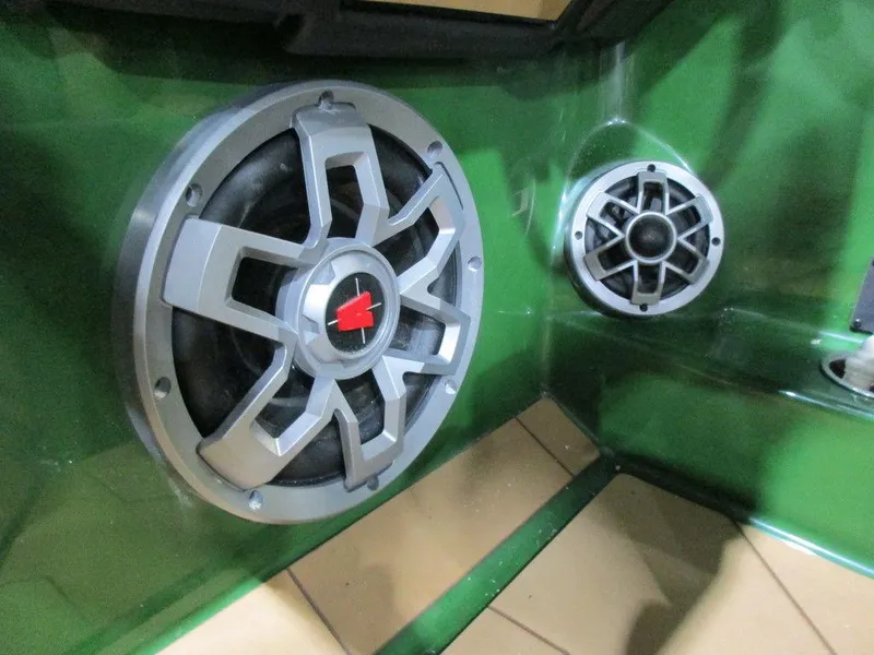 Slide: The Image of 2023 Axis A24 boat interior speakers in green hull. - 10