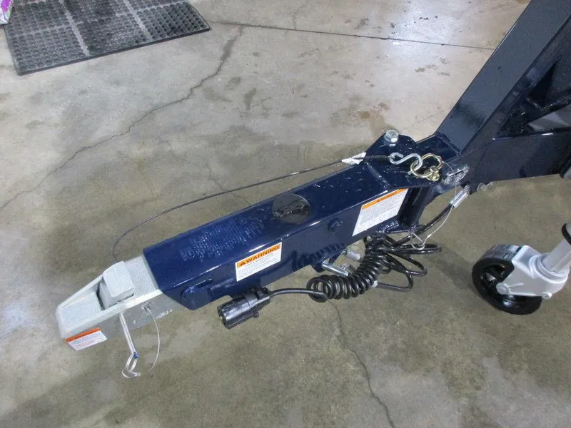 Slide: The Image of 2023 Axis A24 boat trailer hitch and coupler on concrete floor. - 17