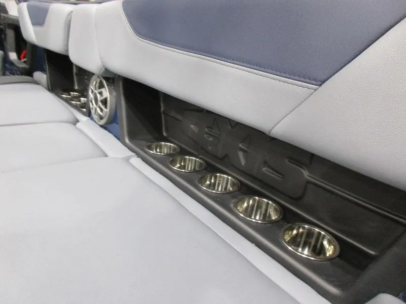 Slide: The Image of 2023 Axis A24 boat interior with cup holders and speaker. - 18
