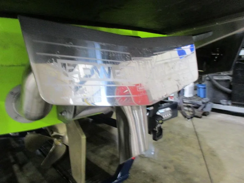 Slide: The Image of 2023 Axis A24 boat propeller and rudder system in a workshop. - 22