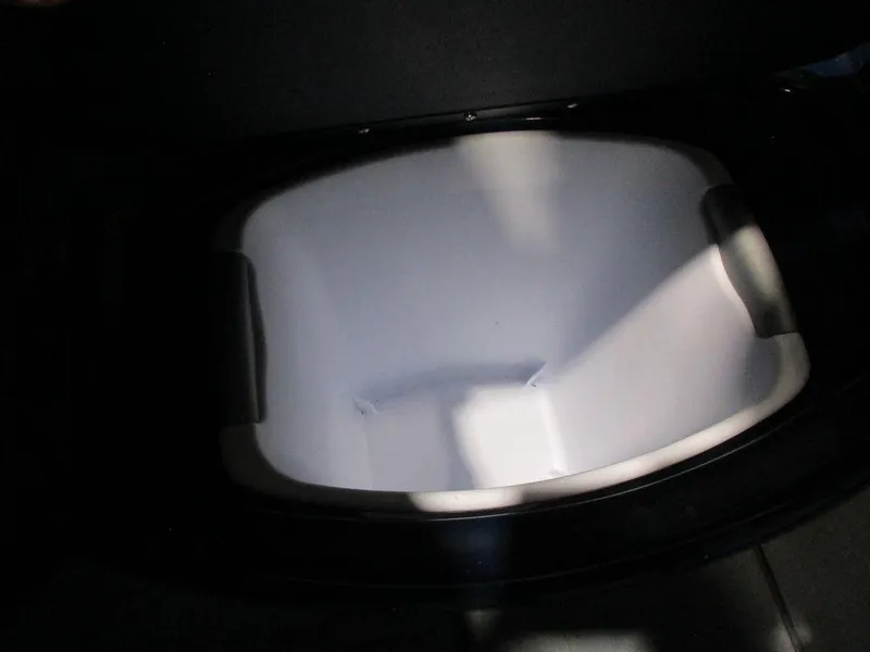 Slide: The Image of 2023 Axis A24 boat storage compartment, open and empty. - 23