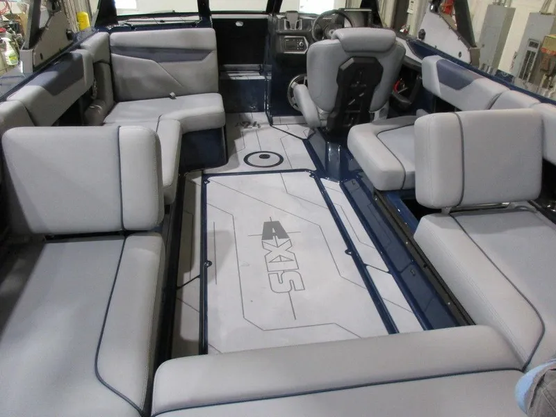 Slide: The Image of 2023 Axis A24 boat interior with gray seating and modern design. - 5