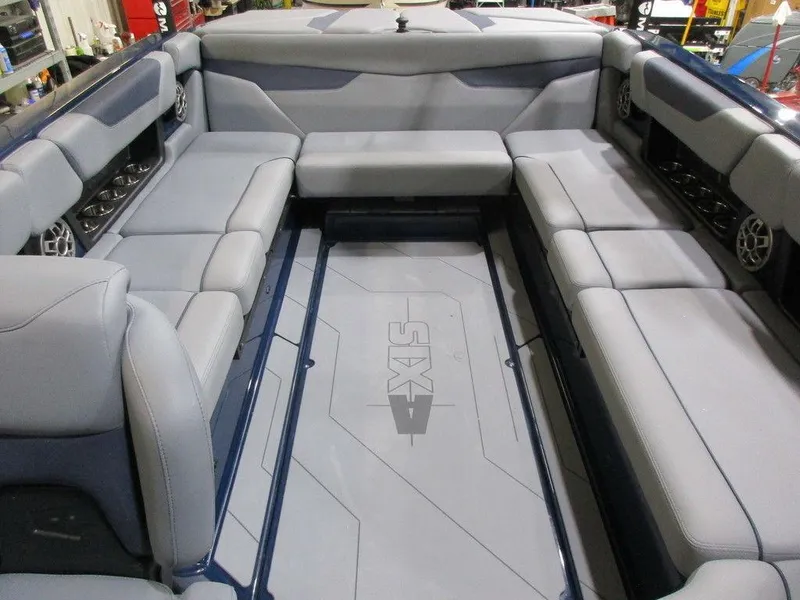 Slide: The Image of 2023 Axis A24 boat interior with spacious seating and modern design. - 7