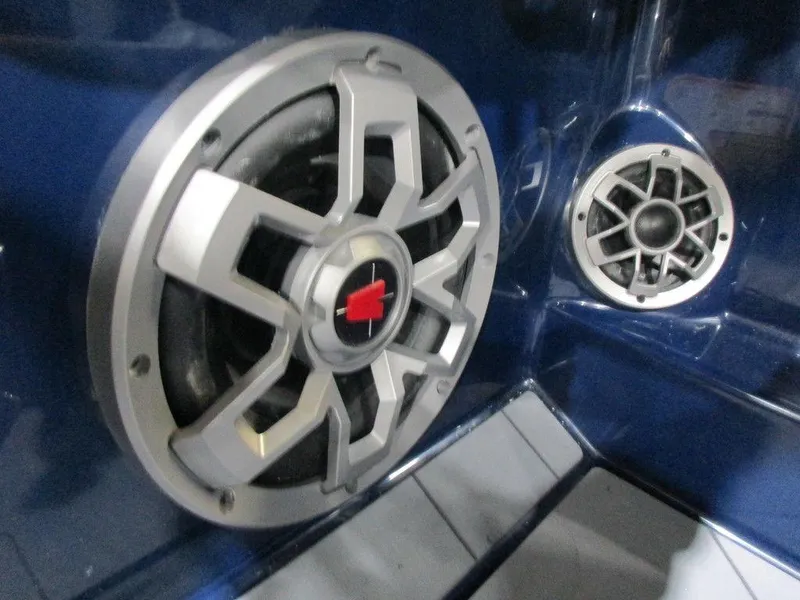 Slide: The Image of Close-up of 2023 Axis A24 boat speakers in blue interior. - 8
