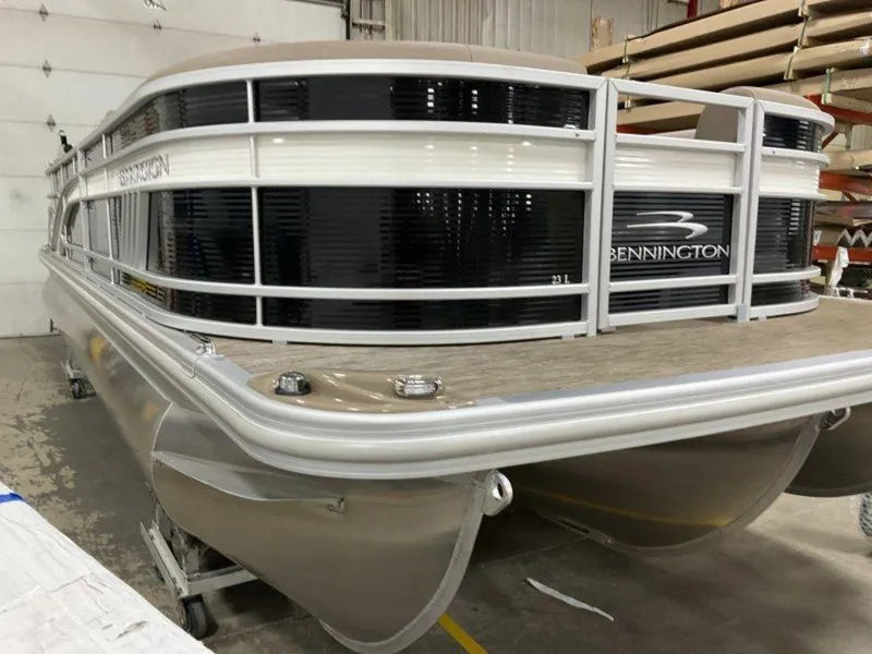 Slide: The Image of 2023 Bennington 23 LSR pontoon boat in a storage facility. - 22