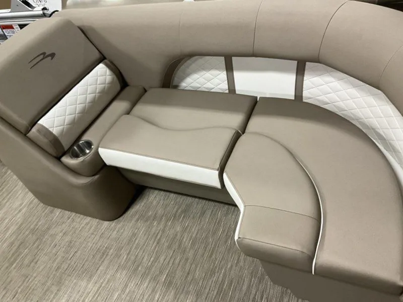 Slide: The Image of 2023 Bennington 23 LSR boat interior with beige and white cushioned seating. - 3