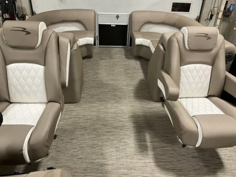 Slide: The Image of 2023 Bennington 23 LSR boat interior with beige and white seating. - 5