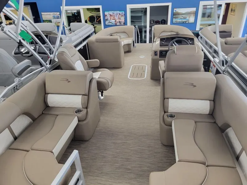 Slide: The Image of 2023 Bennington 23 LSR pontoon boat interior with beige seating and modern design. - 8