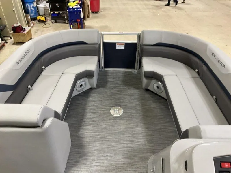 Slide: The Image of 2023 Bennington 23 SXSR pontoon boat interior with gray seating and spacious layout. - 10
